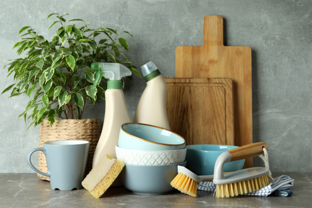 Assortment Of Cleaning Supplies And Kitchenware On