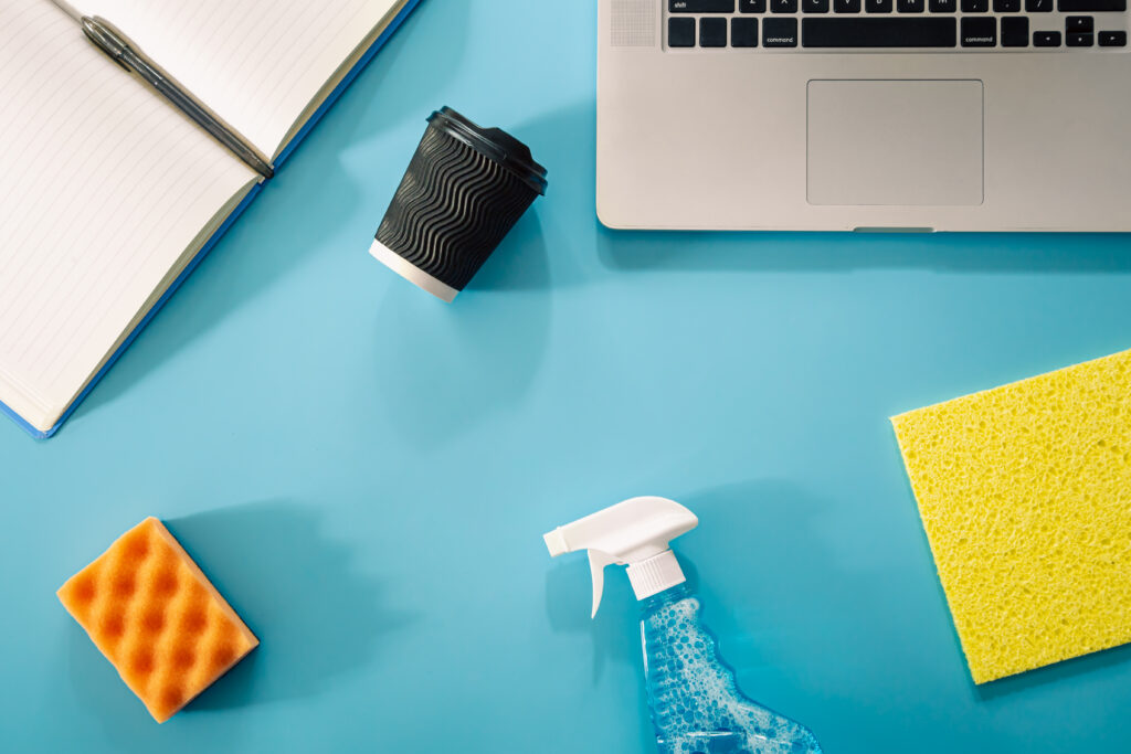 Office Cleaning Supplies And Computer On Desk